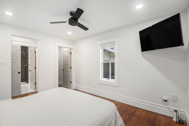 bedroom featuring recessed lighting, ensuite bath, baseboards, and hardwood / wood-style flooring