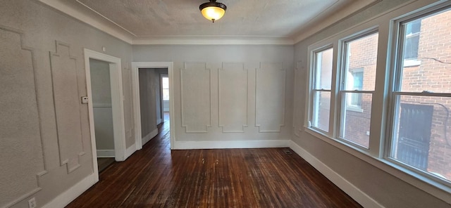 unfurnished room featuring dark wood finished floors and baseboards