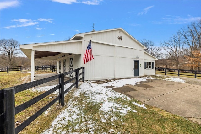 view of property exterior featuring an outbuilding, an exterior structure, and a garage