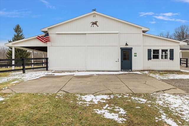 view of front of property with a garage and fence