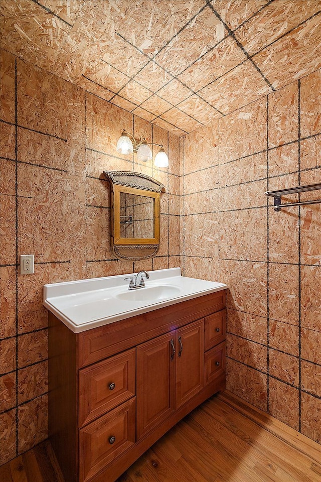bathroom with vanity and wood finished floors