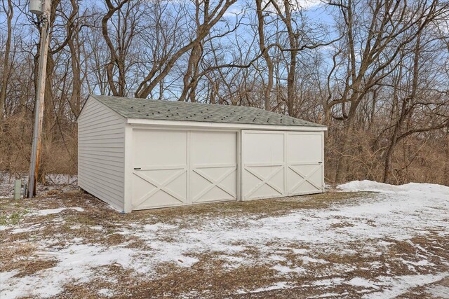 view of snow covered garage