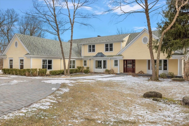 view of front of home with a shingled roof