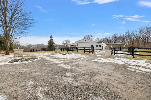 view of road with driveway and a rural view