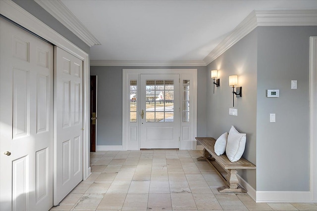 entryway with baseboards and crown molding