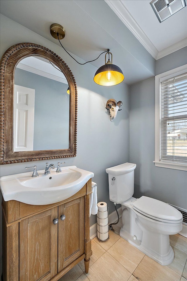 half bath with crown molding, tile patterned flooring, visible vents, vanity, and toilet