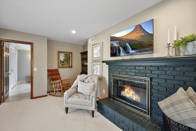 sitting room with visible vents, a brick fireplace, baseboards, recessed lighting, and carpet flooring
