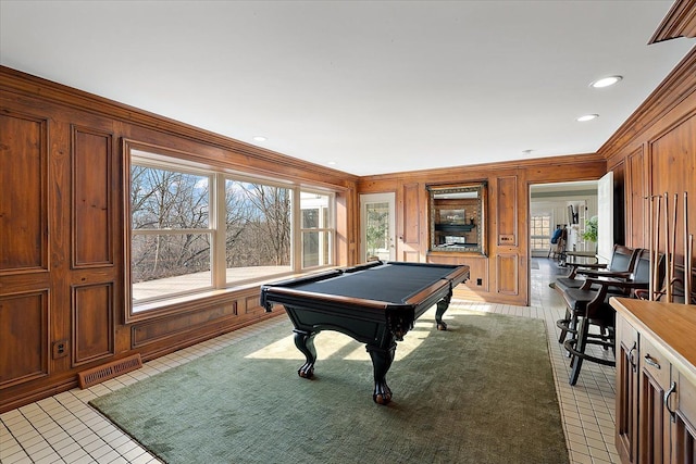 recreation room with visible vents, ornamental molding, billiards, and wooden walls
