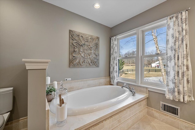 full bathroom featuring visible vents, tile patterned flooring, toilet, recessed lighting, and a bath