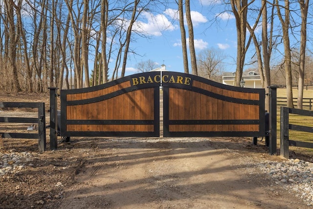 view of gate with fence