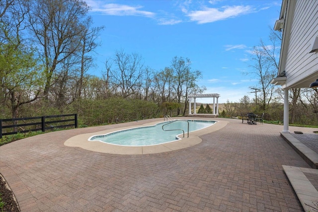 view of pool featuring a fenced in pool, a patio area, fence, and a pergola
