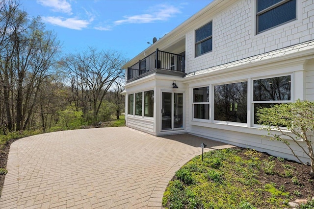 wooden terrace with a patio