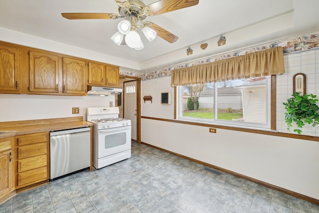 kitchen with white range with gas stovetop, visible vents, dishwasher, light countertops, and under cabinet range hood