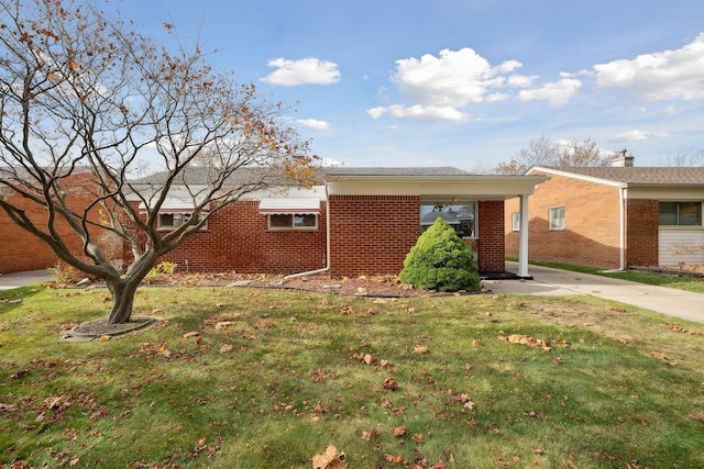 single story home with a front yard and brick siding