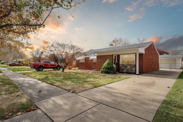 view of front facade featuring a front yard and brick siding