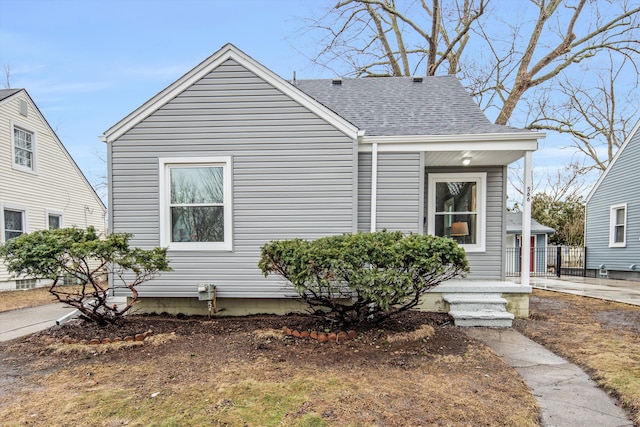 view of front of house with a shingled roof