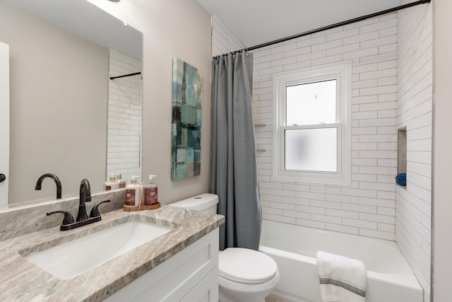 full bathroom featuring shower / bath combo with shower curtain, vanity, and toilet