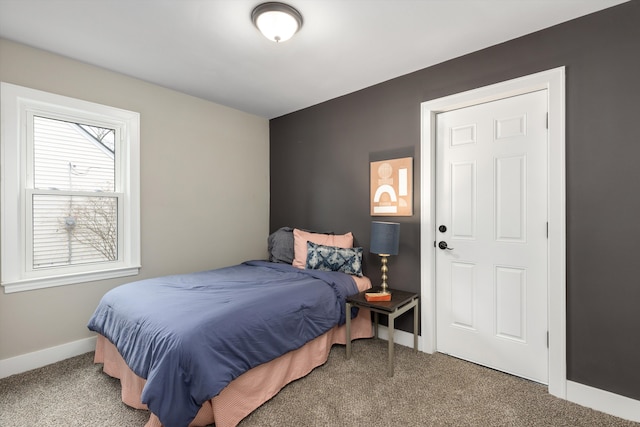 bedroom featuring carpet flooring and baseboards