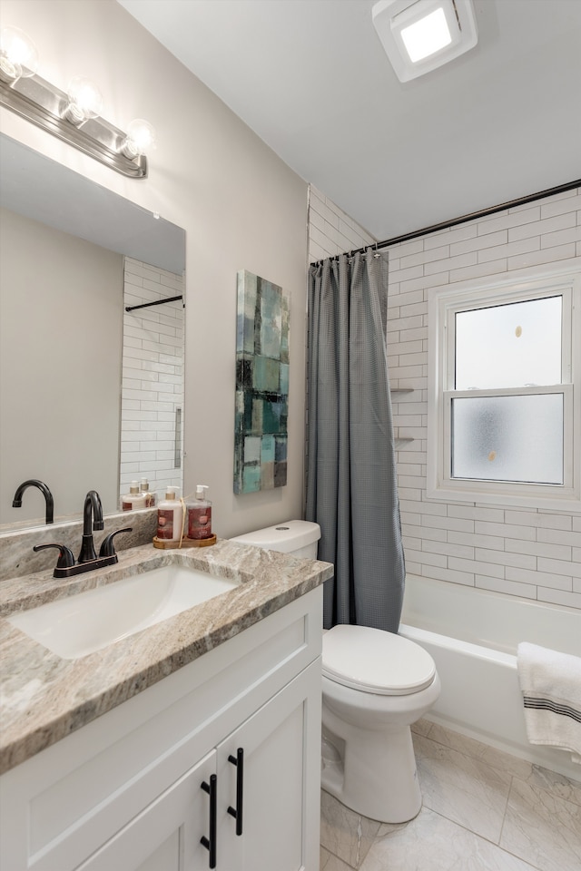 bathroom with toilet, marble finish floor, shower / bath combination with curtain, and vanity