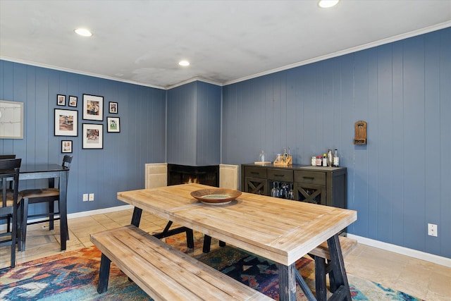 dining space with ornamental molding, recessed lighting, and baseboards