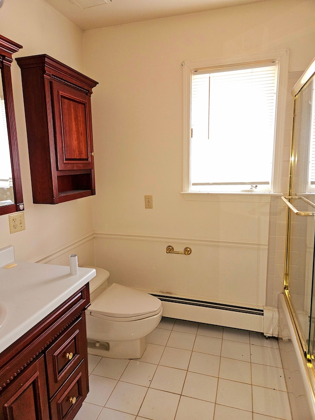 full bathroom featuring a baseboard radiator, vanity, toilet, and tile patterned floors