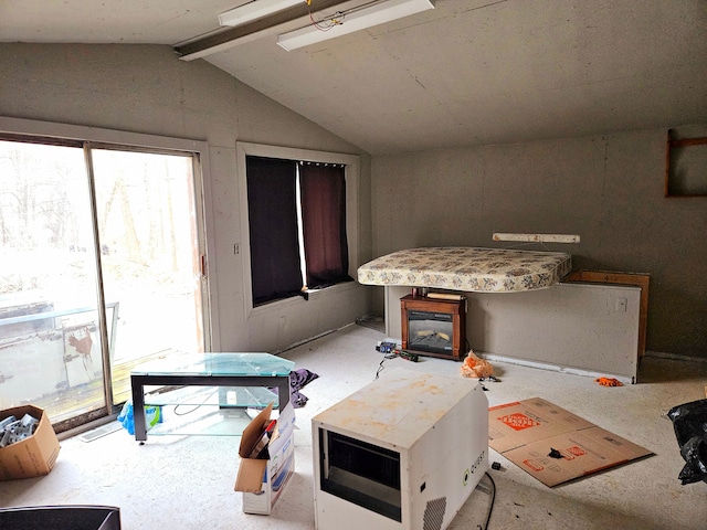 living area featuring vaulted ceiling