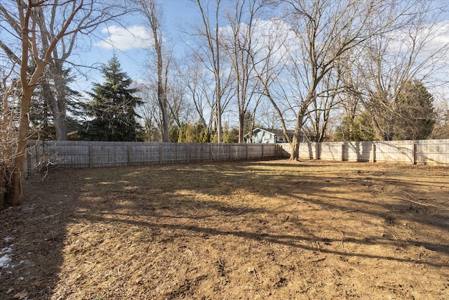 view of yard with a fenced backyard