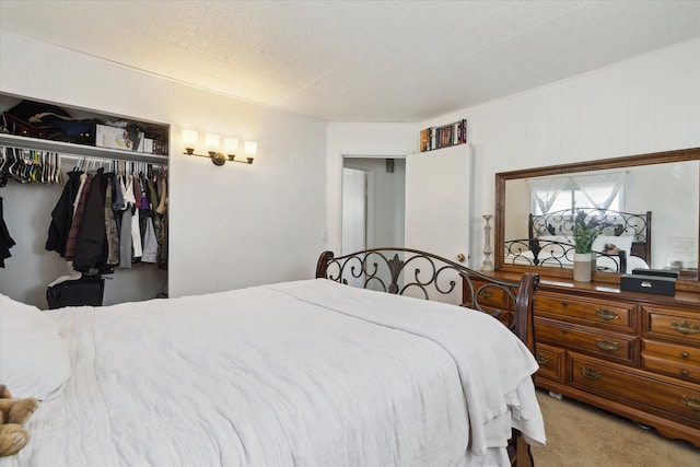 carpeted bedroom featuring a closet