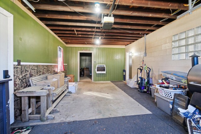 basement with heating unit and concrete block wall