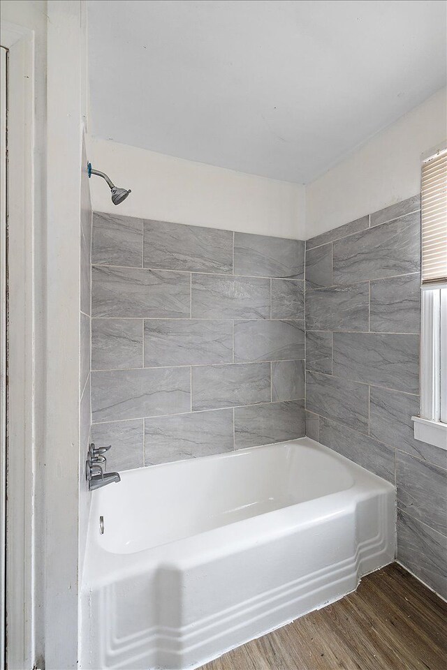 bathroom with  shower combination and wood finished floors