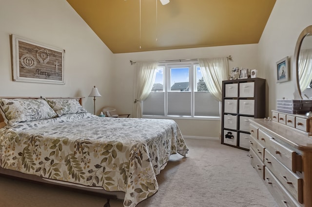 bedroom with lofted ceiling, baseboards, and light colored carpet