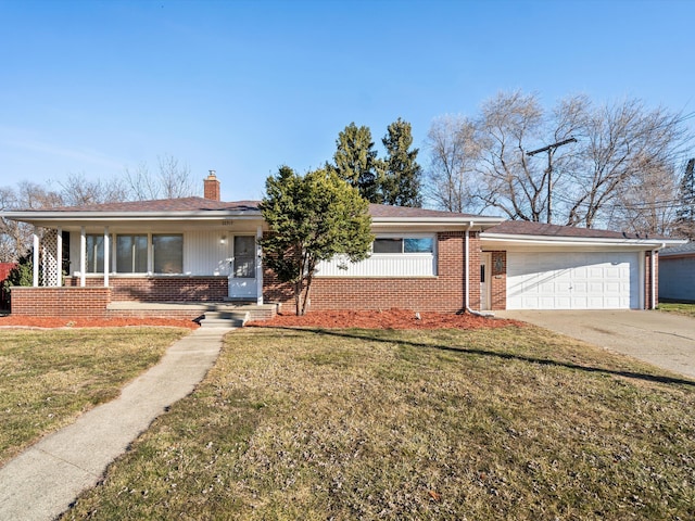 ranch-style house with brick siding, a chimney, concrete driveway, and a front yard