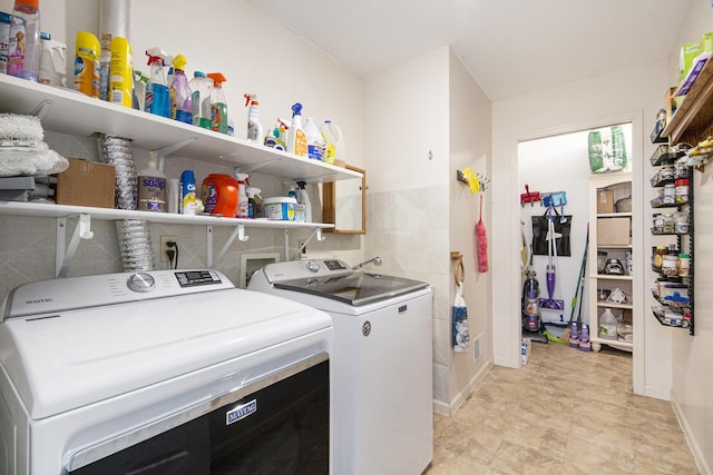 laundry area featuring washing machine and dryer and laundry area