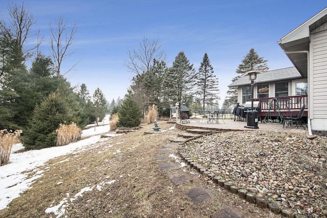 view of yard featuring a patio and a deck