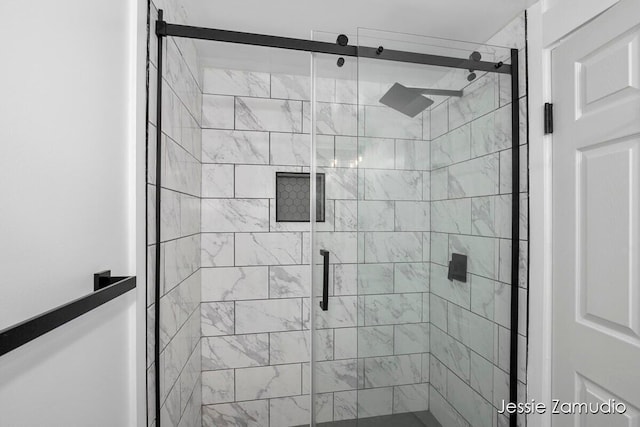 bathroom featuring a shower stall