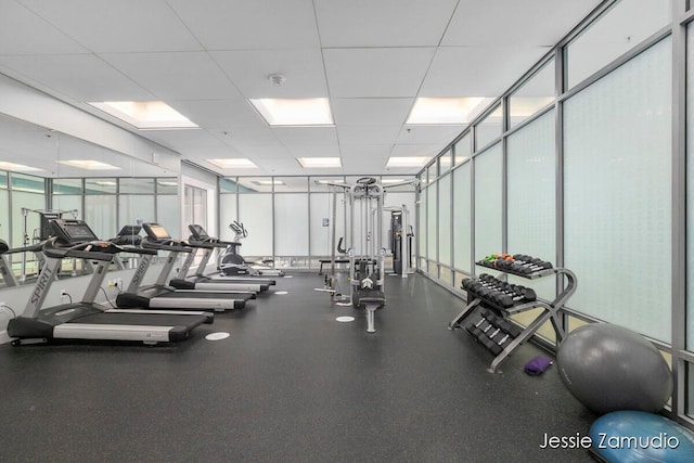 exercise room with a paneled ceiling