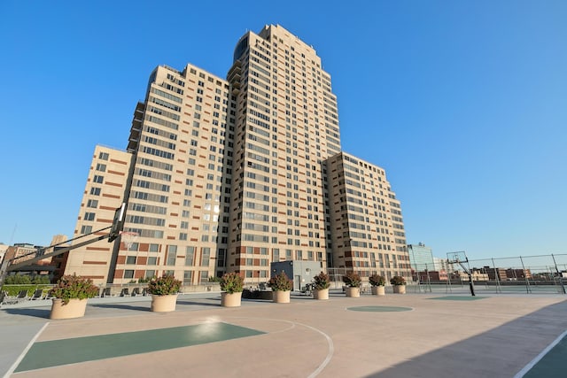 view of building exterior with fence