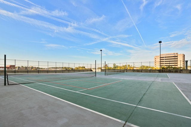 view of sport court with fence