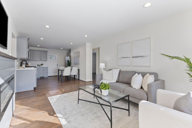 living room featuring wood finished floors and recessed lighting