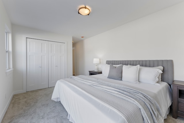 bedroom featuring carpet floors, a closet, and baseboards