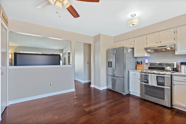 kitchen with decorative backsplash, dark wood-style floors, stainless steel appliances, under cabinet range hood, and white cabinetry