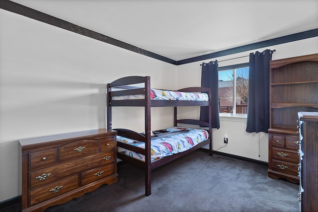 bedroom with carpet and baseboards