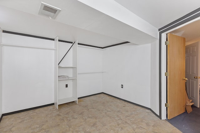 interior space featuring baseboards and visible vents