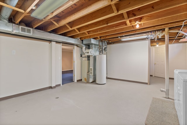 unfinished below grade area with gas water heater, visible vents, independent washer and dryer, and baseboards