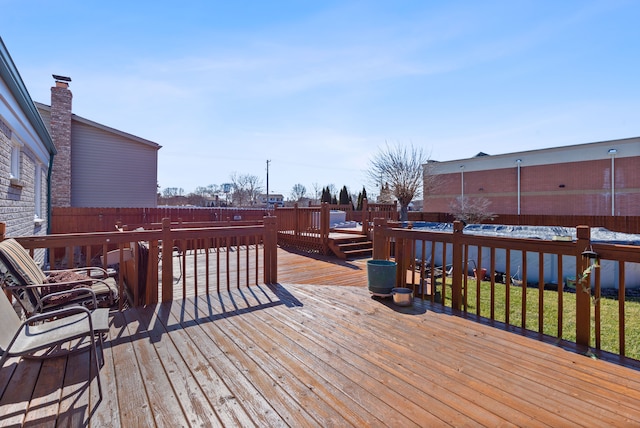 deck with a fenced backyard