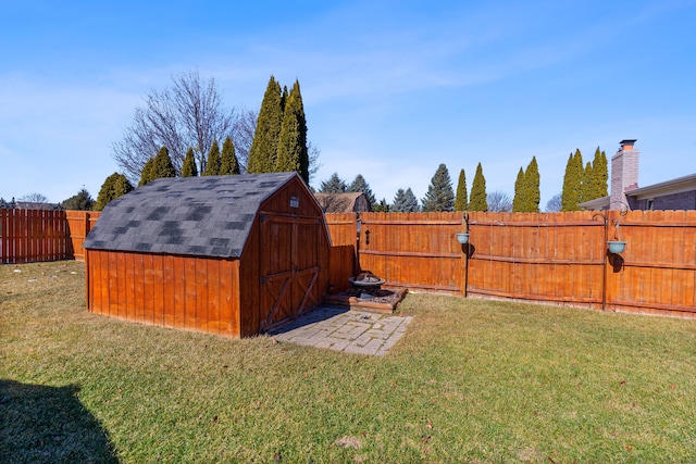 view of shed with a fenced backyard