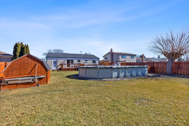 view of yard featuring a fenced in pool and fence