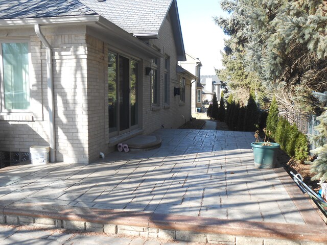 13267 Pearl Dr, Utica, MI 48315 - exterior space with a patio area and brick siding