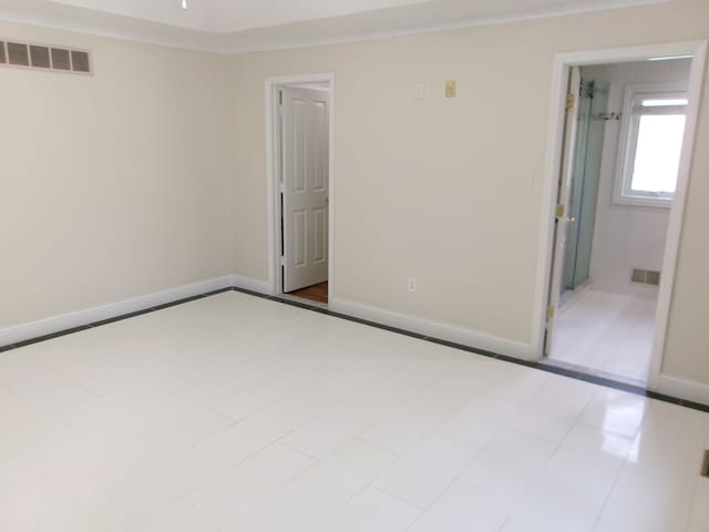 13267 Pearl Dr, Utica, MI 48315 - empty room with crown molding, baseboards, and visible vents