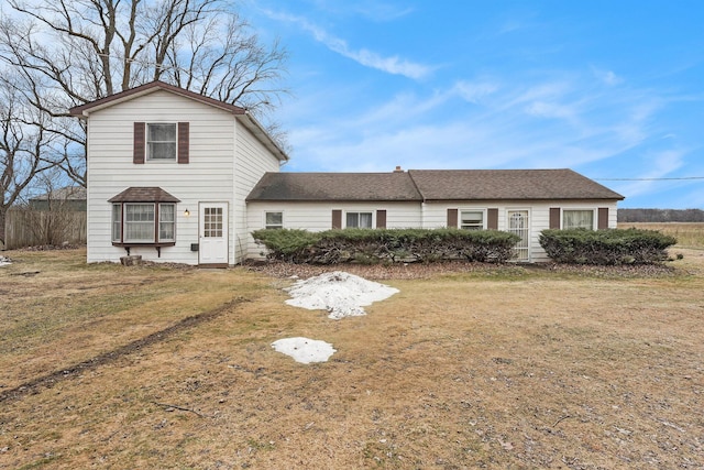 traditional-style home with a front yard